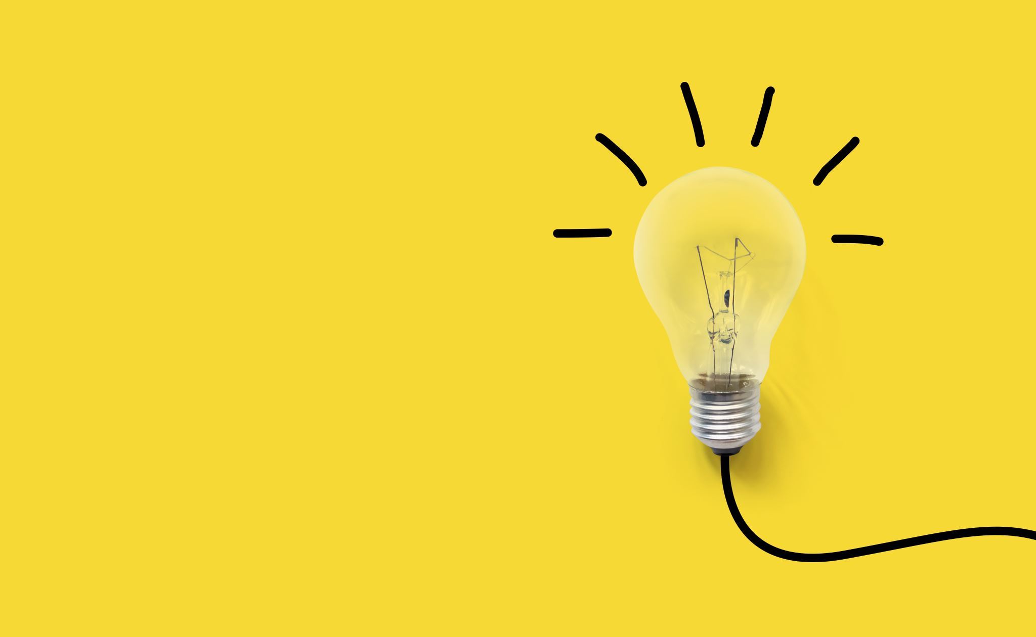 Light-bulb-on-yellow-background-with-sketched-light-beams-and-cord